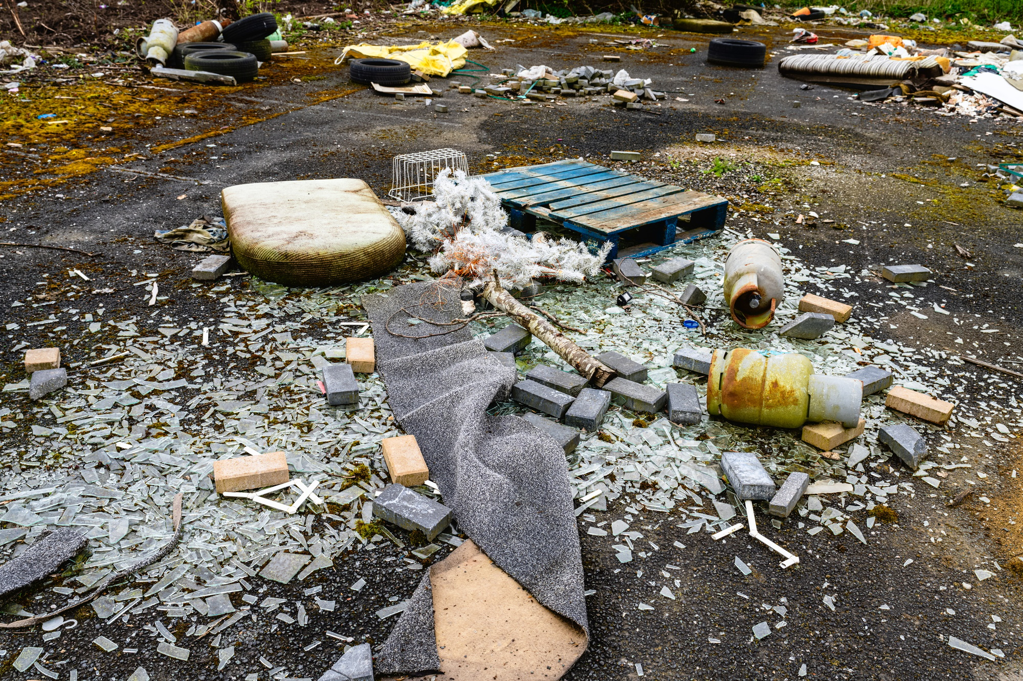 Fly tipping, rubbish dumped illegally by the road side.